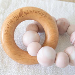 Teething Toy silicone and beech wood. Handmade in Australia by Bowerbird Creations. Pink Marble Halo Teether Toy.