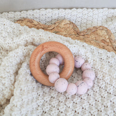 Handmade teething toy for babies, made from non-toxic silicone and beech wood. Pink Granite. Made in Australia by Bowerbird Creations.