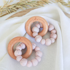 Handmade teething toy for babies, made from non-toxic silicone and beech wood. Pink Granite. Made in Australia by Bowerbird Creations.