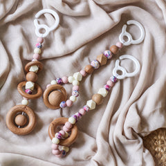 3 handmade silicone and wood baby play gym toys in pink, floral and cream