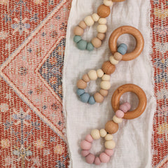 Teething toys handmade in Australia by Bowerbird Creations. Silicone and Beech wood. Neutral blue, sage and pink.
