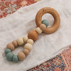 Teething toy handmade in Australia by Bowerbird Creations. Silicone and Beech wood. Neutral sage and beige.