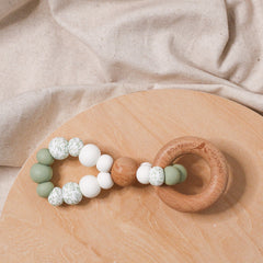 Teething toy infinity. Handmade from silicone and beech wood by Bowerbird Creations. Made in Australia. Beige, Sage, Eucalyptus.