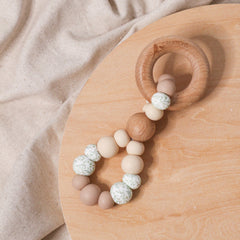 Teething toy infinity. Handmade from silicone and beech wood by Bowerbird Creations. Made in Australia. Beige, Eucalyptus.