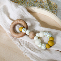 Handmade teething toy. Made in Australia from BPA-free silicone and beech wood. Non-toxic and safe. Bowerbird Creations. Cream, mustard and wattle.