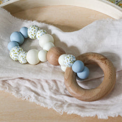 Handmade teething toy. Made in Australia from BPA-free silicone and beech wood. Non-toxic and safe. Bowerbird Creations. Blue, cream and wattle.