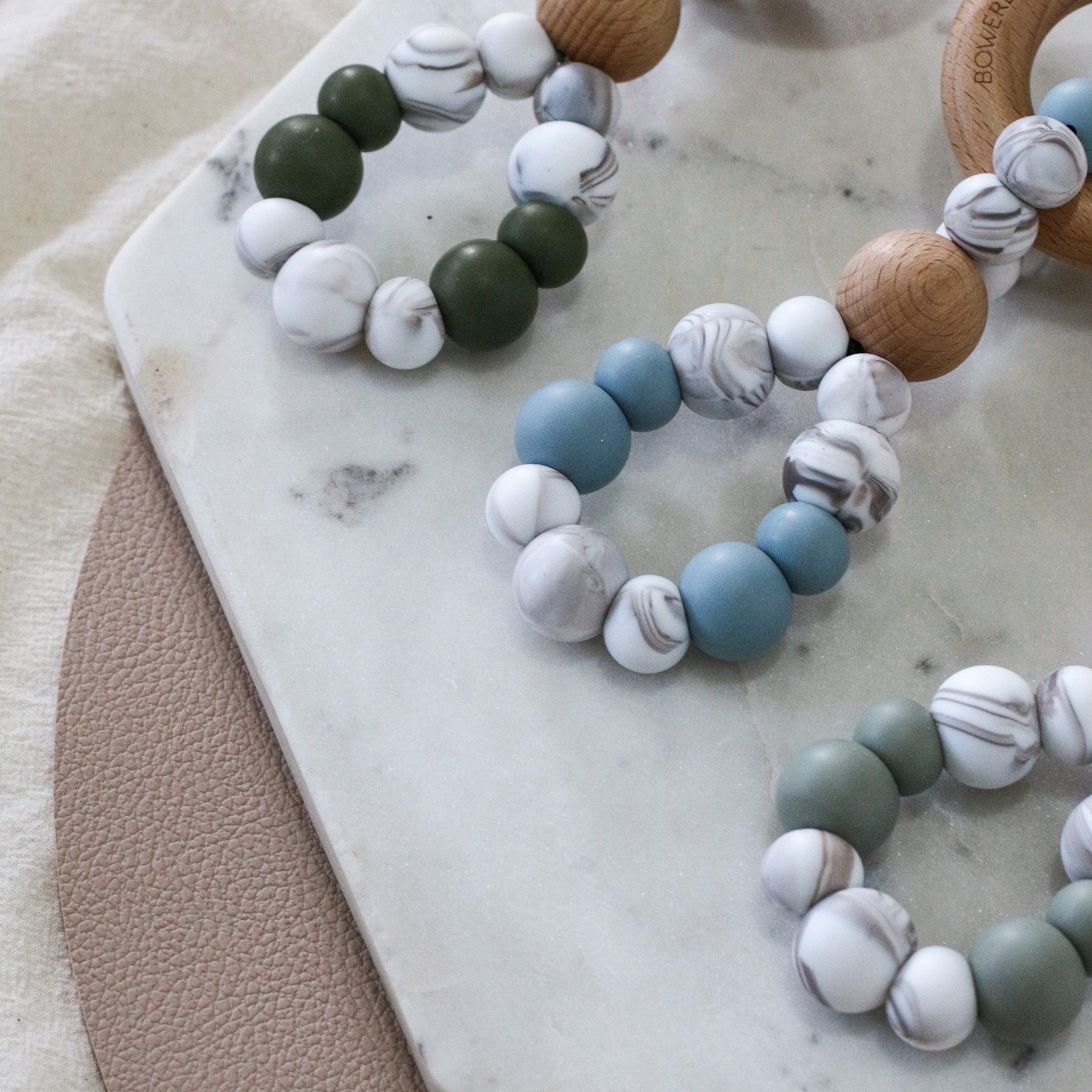 Teething toys infinity by Bowerbird Creations. Handmade from silicone and beech wood timber teething ring. Made in Australia. Marble and Sage.