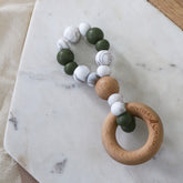 Infinity teething toy in marble and olive. Handmade in Australia by Bowerbird Creations from BPA-free silicone and beech wood timber teething ring. Non-toxic and safe.
