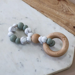 Teething toy infinity by Bowerbird Creations. Handmade from silicone and beech wood timber. Made in Australia. Marble and Sage.