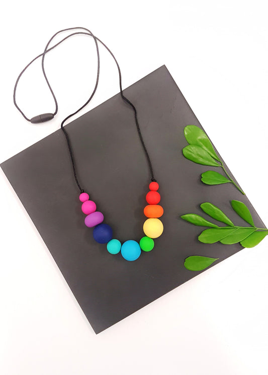 Rainbow silicone necklace. Waterproof and washable. Great for busy mums.