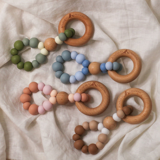 Infinity teething toys Nature. Blue, green, pink and brown. Handmade in Australia from BPA-free silicone and natural beech wood timber teething ring. 
