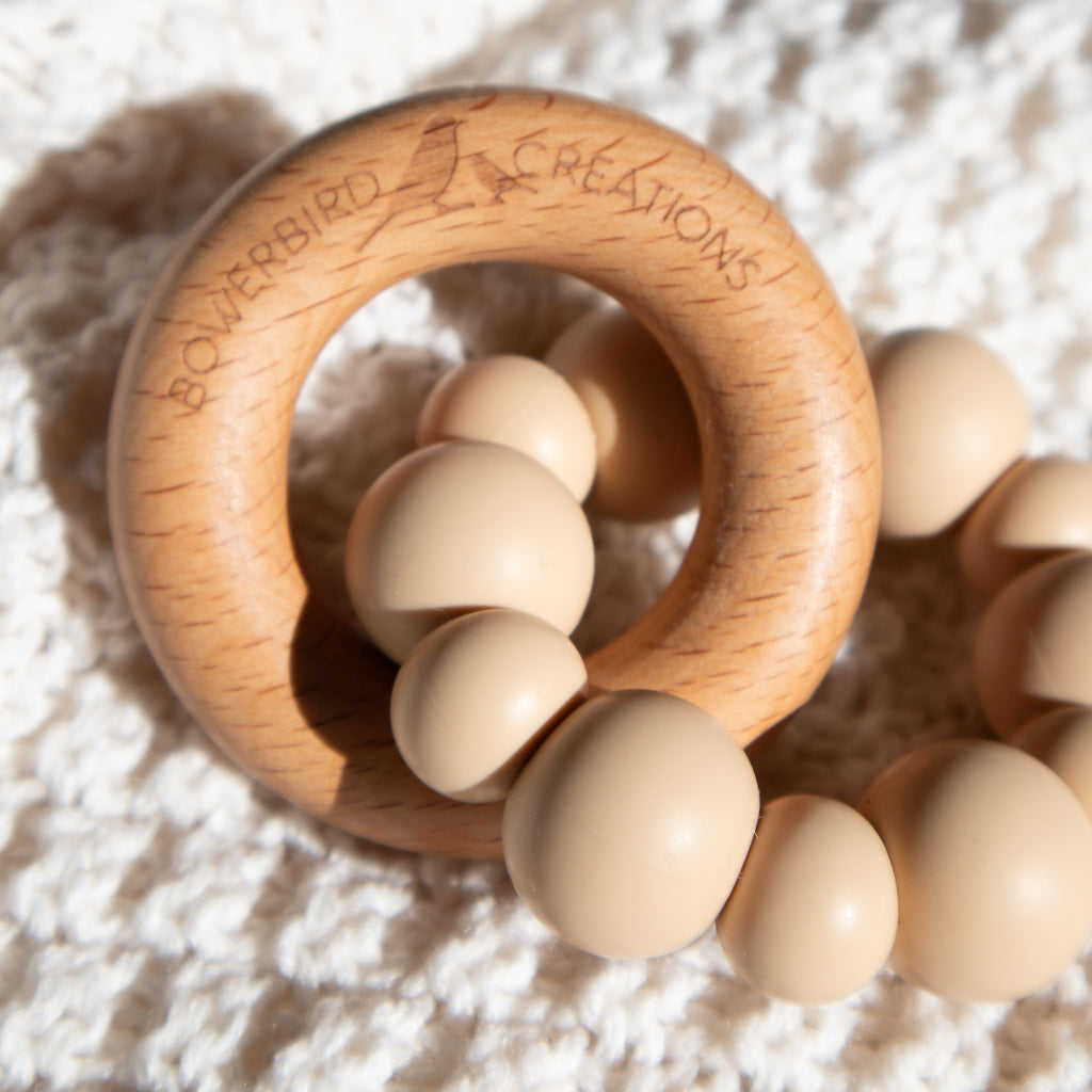 Handmade teething toy for babies, made from non-toxic silicone and beech wood. Beige/Taupe. Made in Australia by Bowerbird Creations. 