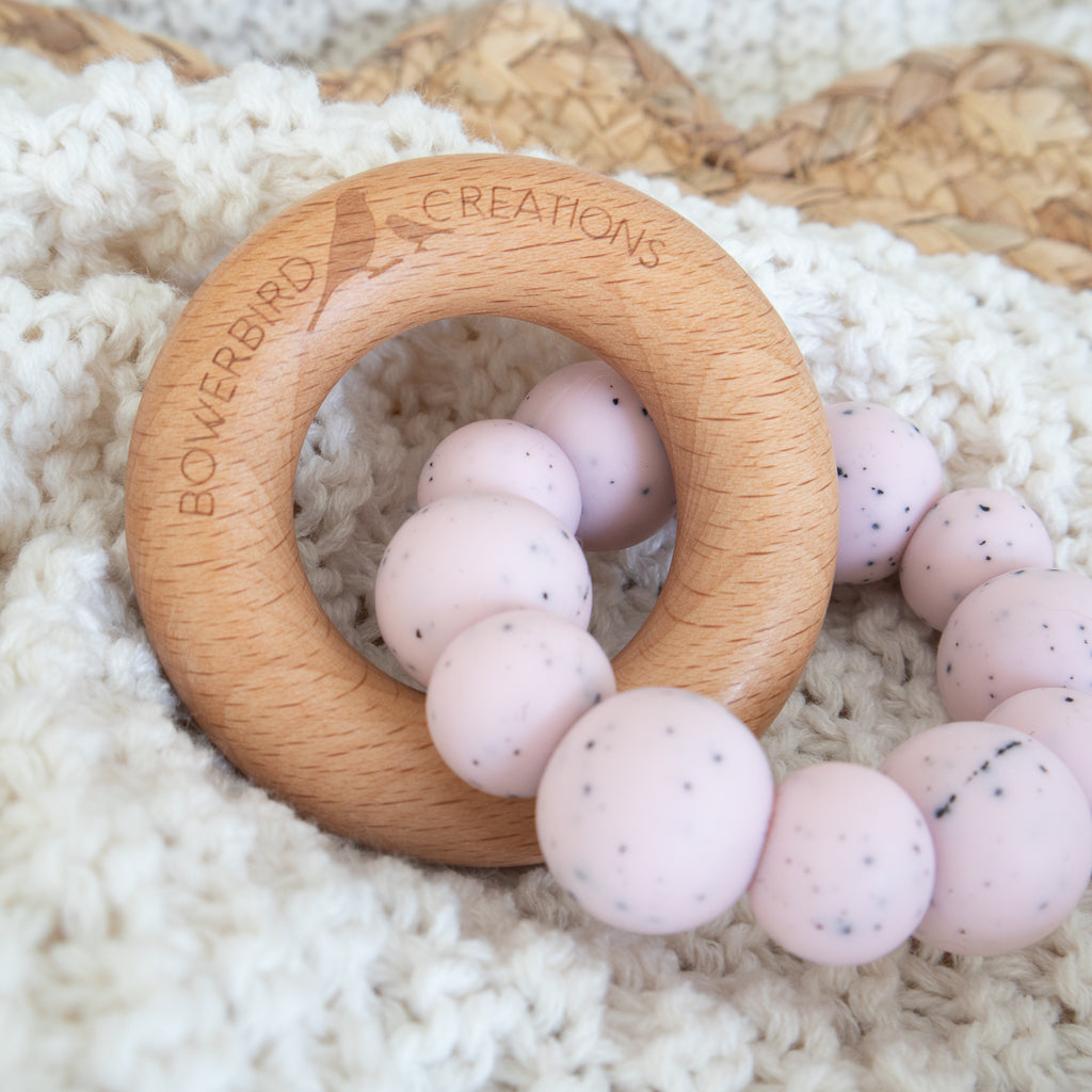 Handmade teething toy for babies, made from non-toxic silicone and beech wood. Pink Granite. Made in Australia by Bowerbird Creations. 
