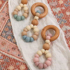 Teething toys handmade in Australia by Bowerbird Creations. Silicone and Beech wood. Neutral blue, sage and pink.