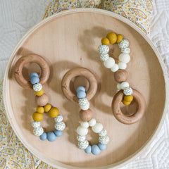 Handmade teething toys. Made in Australia from BPA-free silicone and beech wood. Non-toxic and safe. Bowerbird Creations. Blue, cream, mustard and wattle. 