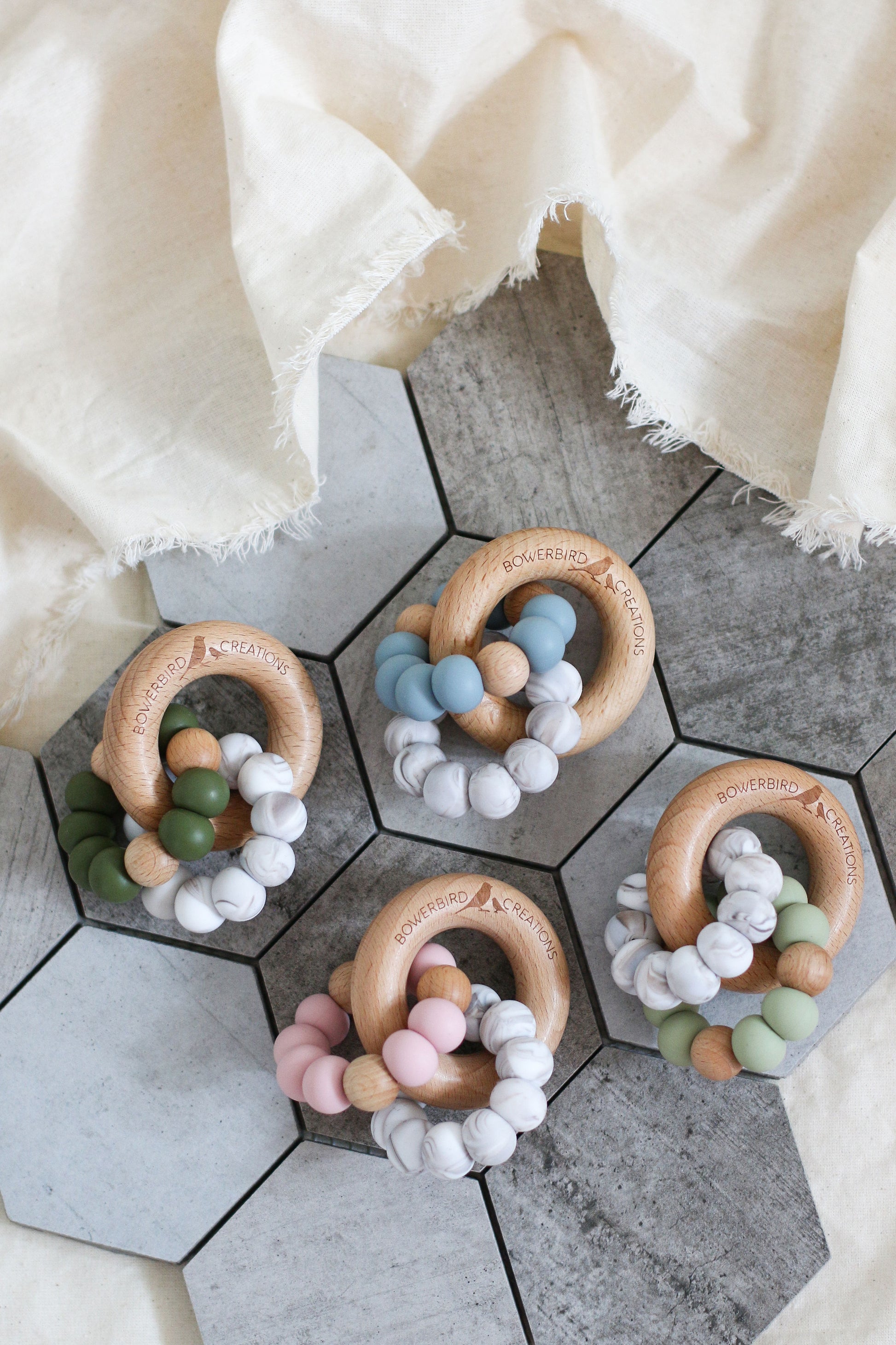Wonderous teething toy. Baby chew toy handmade with silicone and natural beech wood. Blue, pink, sage, beige, marble.