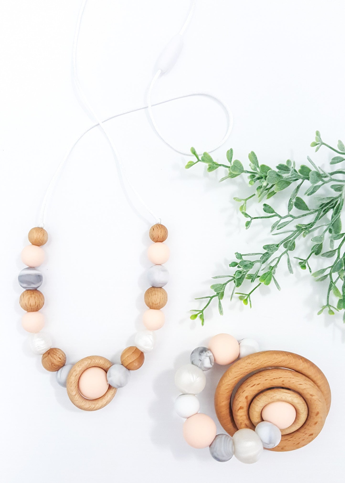 This stunning Peach collection features a Teething rattle for Baby and a gorgeous matching necklace for Mum. Available as a set or separately. - Saturn Set (also available separately) - Bowerbird Creations